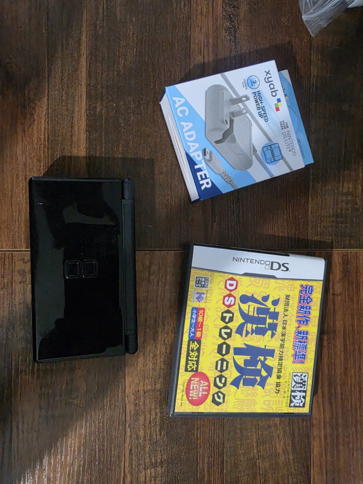Nintendo DS Lite “AS IS” Handheld System – Onyx Black+charger(generic)+game