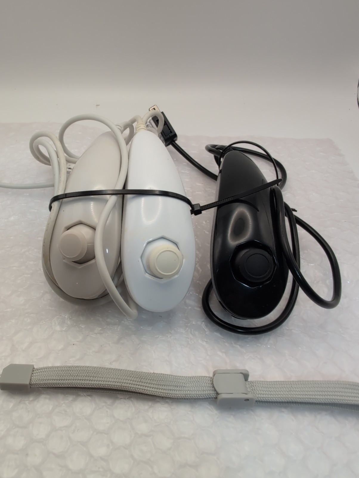 Nintendo Wii U Console Bundle – 3 Remotes & Nunchucks, Battery Packs, & Games