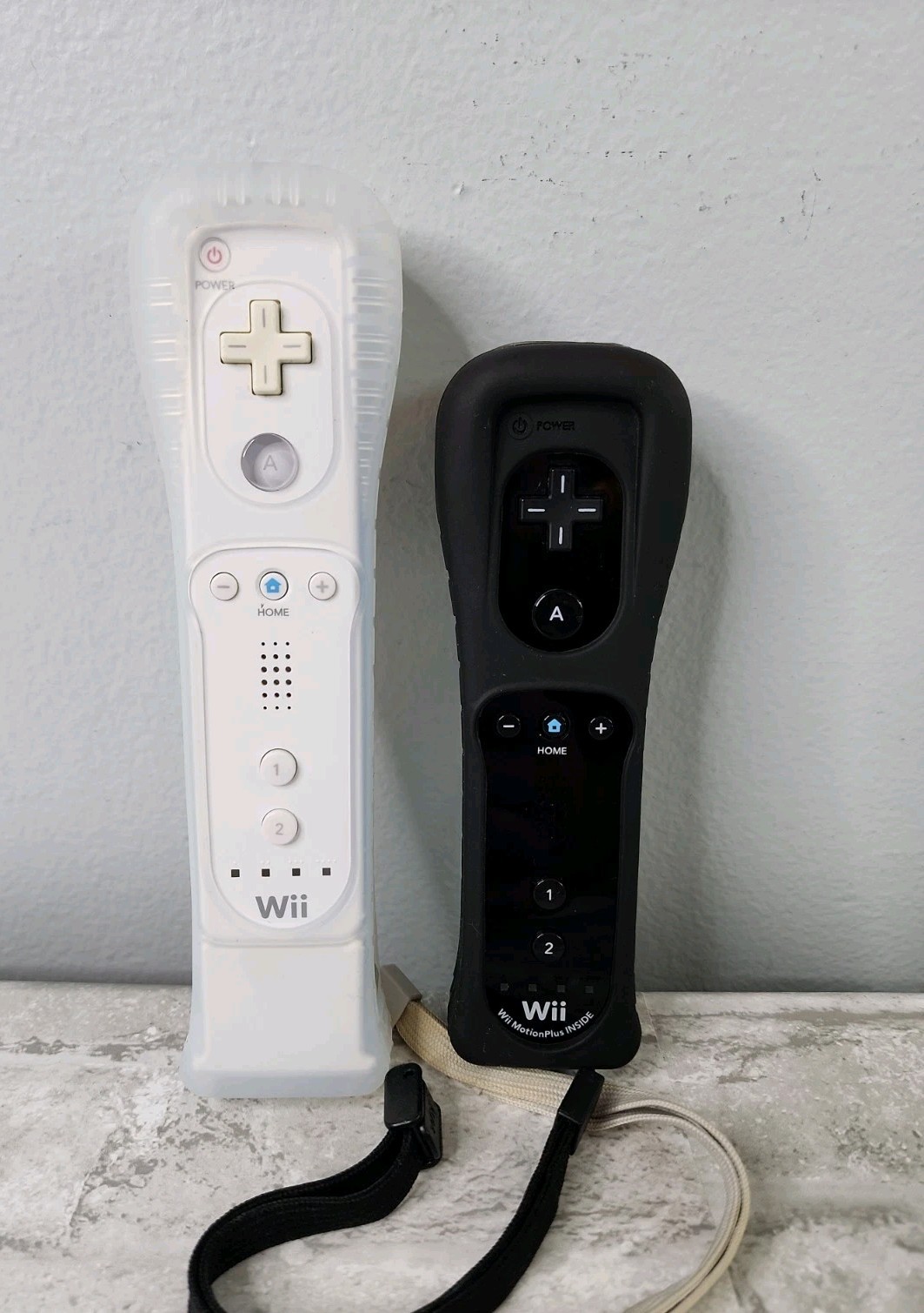 Lot Of 2 Nintendo Wii OEM Wiimotes Remotes Motion Plus Black & White w/ Covers